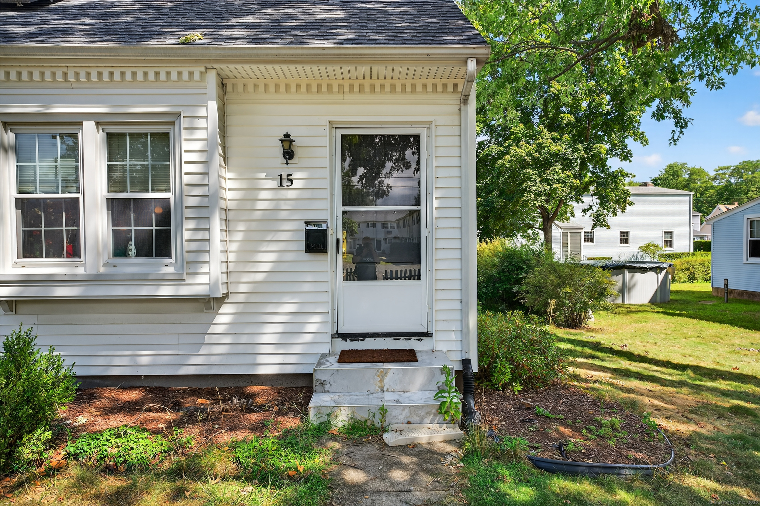 15 St John Street Manchester, CT 06040 - Photo 10 of 36 a front view of a house with a yard