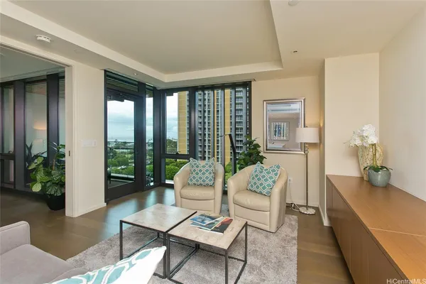 a living room with furniture and a large window