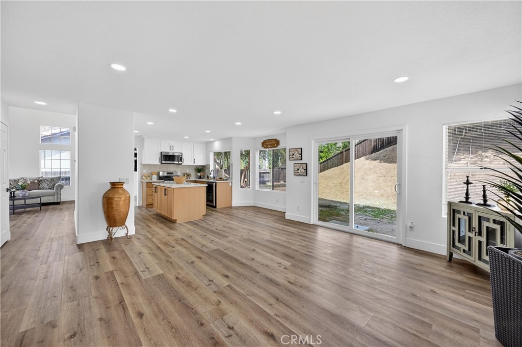 21484 Dickinson Road Moreno Valley, CA 92557 - Photo 19 of 48 a view of kitchen with furniture and wooden floor