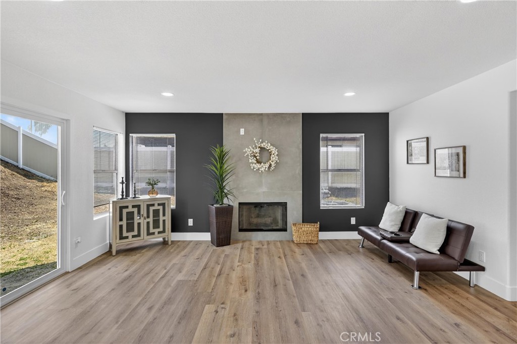 21484 Dickinson Road Moreno Valley, CA 92557 - Photo 22 of 48 a living room with furniture and a fireplace