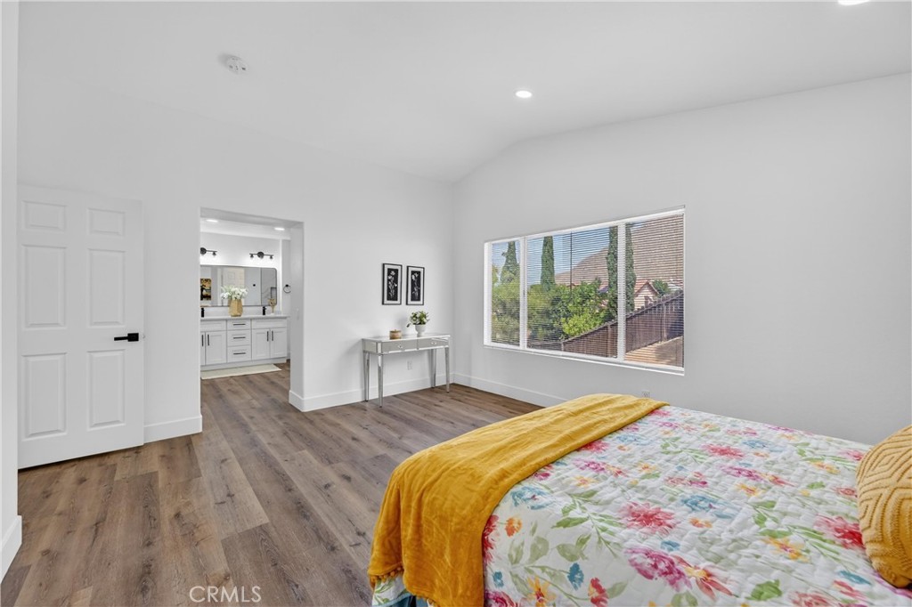 21484 Dickinson Road Moreno Valley, CA 92557 - Photo 26 of 48 a bedroom with a bed and a window