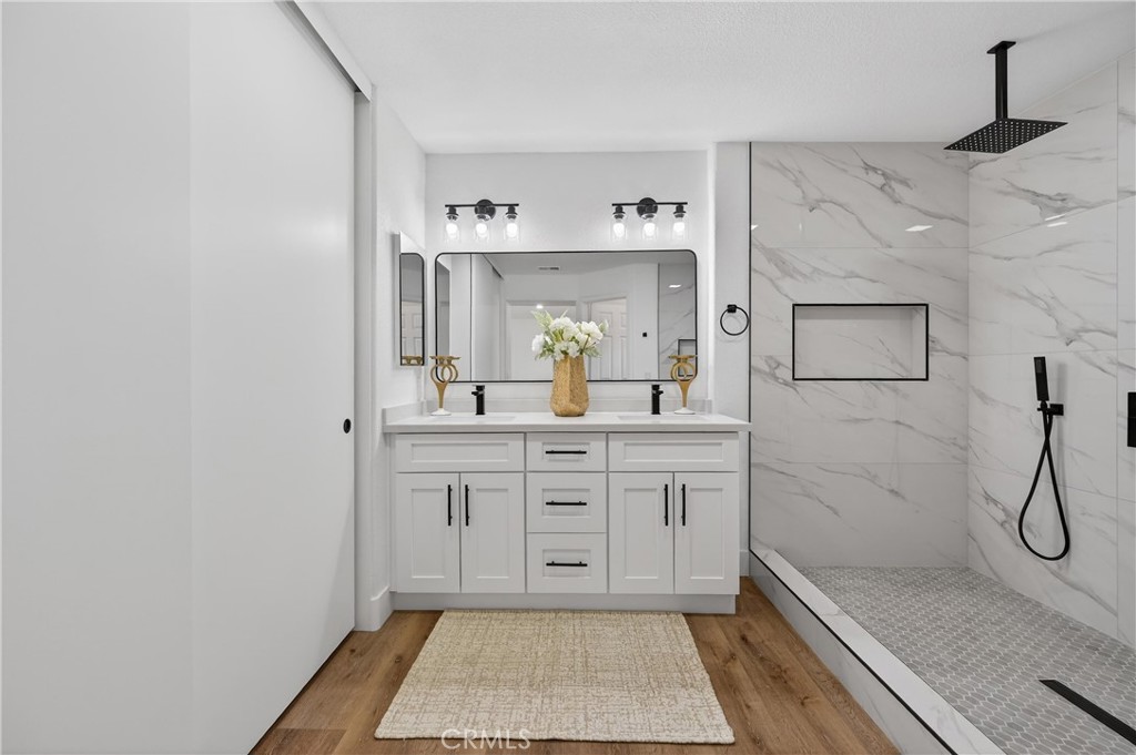21484 Dickinson Road Moreno Valley, CA 92557 - Photo 29 of 48 a bathroom with a sink and a mirror