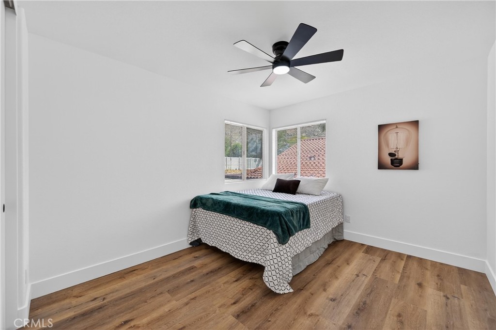 21484 Dickinson Road Moreno Valley, CA 92557 - Photo 34 of 48 a bedroom with a bed and a window