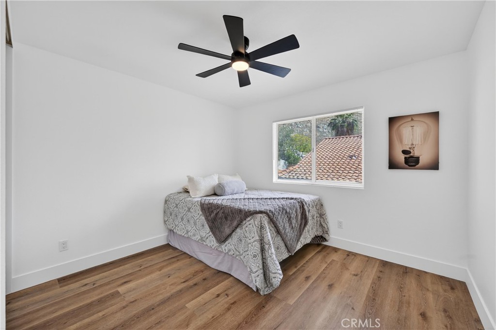 21484 Dickinson Road Moreno Valley, CA 92557 - Photo 38 of 48 a bed sitting in a bedroom next to a window