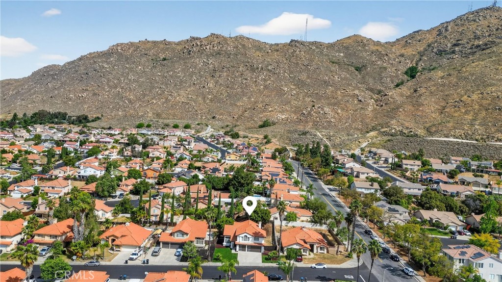 21484 Dickinson Road Moreno Valley, CA 92557 - Photo 46 of 48 an aerial view of residential houses with outdoor space and trees