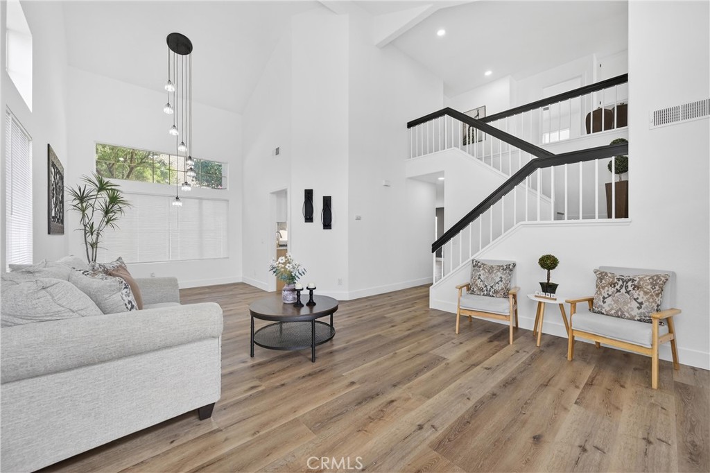 21484 Dickinson Road Moreno Valley, CA 92557 - Photo 6 of 48 a living room with furniture and wooden floor