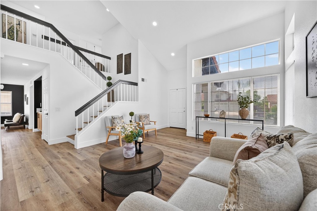 21484 Dickinson Road Moreno Valley, CA 92557 - Photo 7 of 48 a living room with furniture and wooden floor