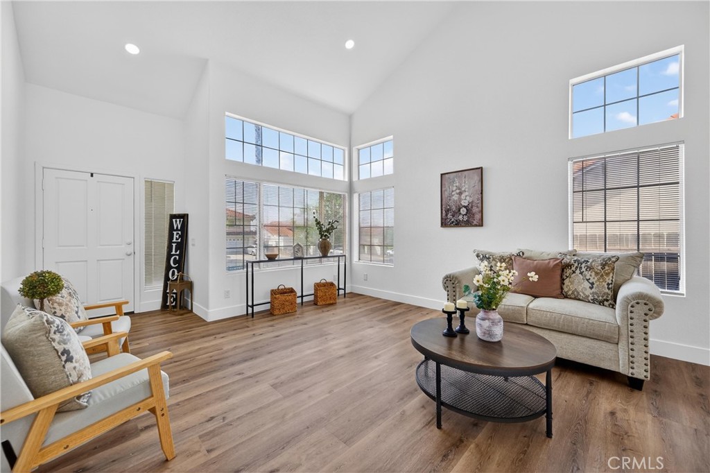 21484 Dickinson Road Moreno Valley, CA 92557 - Photo 9 of 48 a living room with furniture and wooden floor