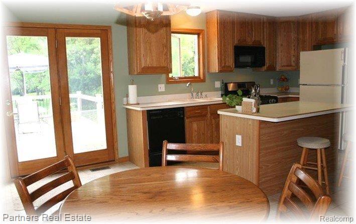 11095 Culver Road Brighton, MI 48114 - Photo 8 of 25 Kitchen with Patio Door to Deck