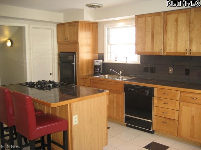 3769 Silsby Road Cleveland, OH 44118 - Photo 7 of 19 Fantastic Eat-In Kitchen With Center Island and Much Counter Space - Ideal for Buyers Who Love to Cook!