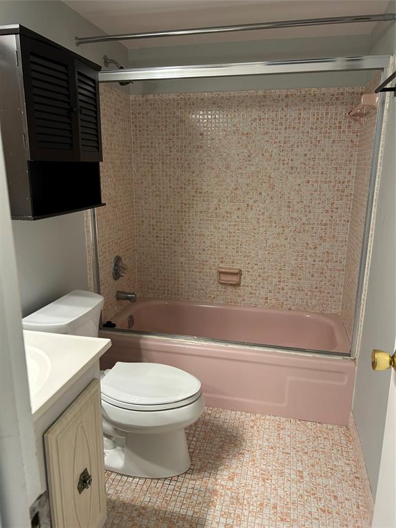 31 Abbey Lane, Unit 207 Delray Beach, FL 33446 - Photo 11 of 15 a white toilet sitting next to a bath tub