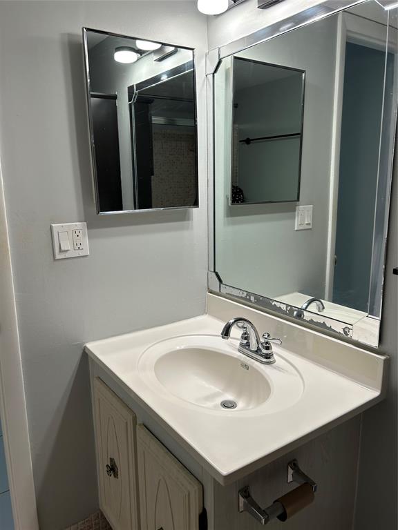 31 Abbey Lane, Unit 207 Delray Beach, FL 33446 - Photo 12 of 15 a bathroom with a sink and a mirror
