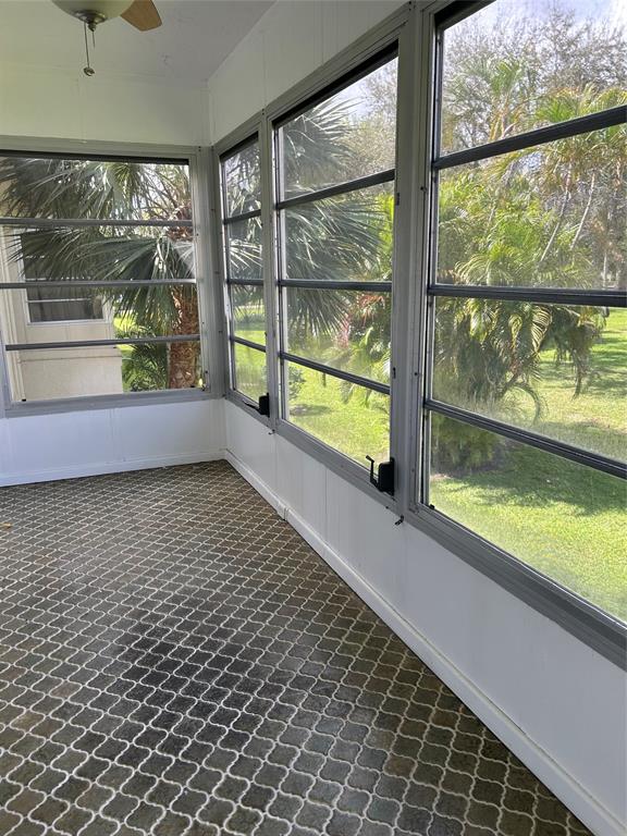 31 Abbey Lane, Unit 207 Delray Beach, FL 33446 - Photo 15 of 15 a view of empty room with wooden floor and a window
