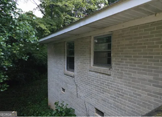 a view of a field with of trees