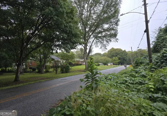 a view of a house with a tree