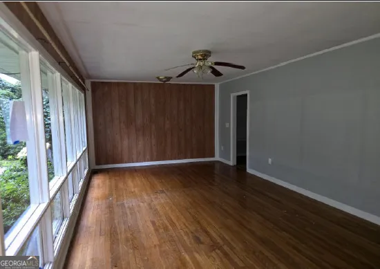 a kitchen with a sink and a stove next to a window