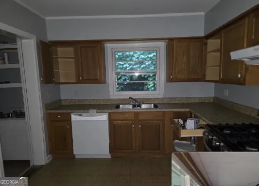 a bathroom with a shower and a sink