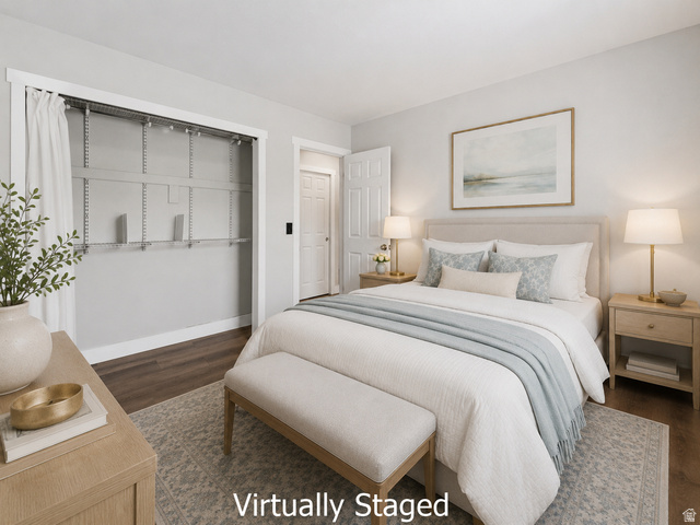 2693 Teal Way Sandy, UT 84093 - Photo 21 of 50 Bedroom featuring wood-finish flooring, light grey wall paint, and a built-in closet with adjustable shelving