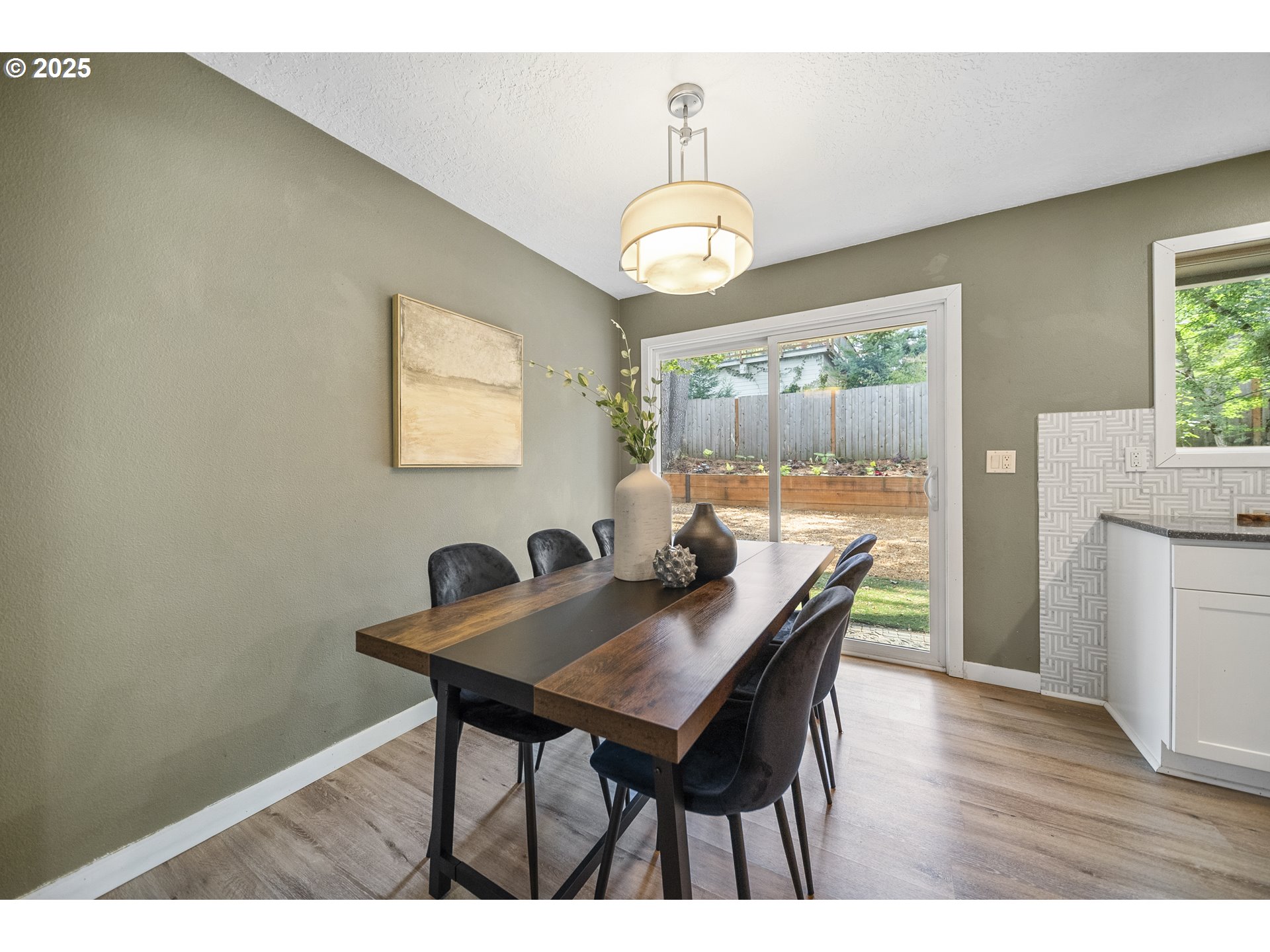 712 Southwest 4th Street Gresham, OR 97080 - Photo 11 of 47 a view of a dining room with furniture and wooden floor