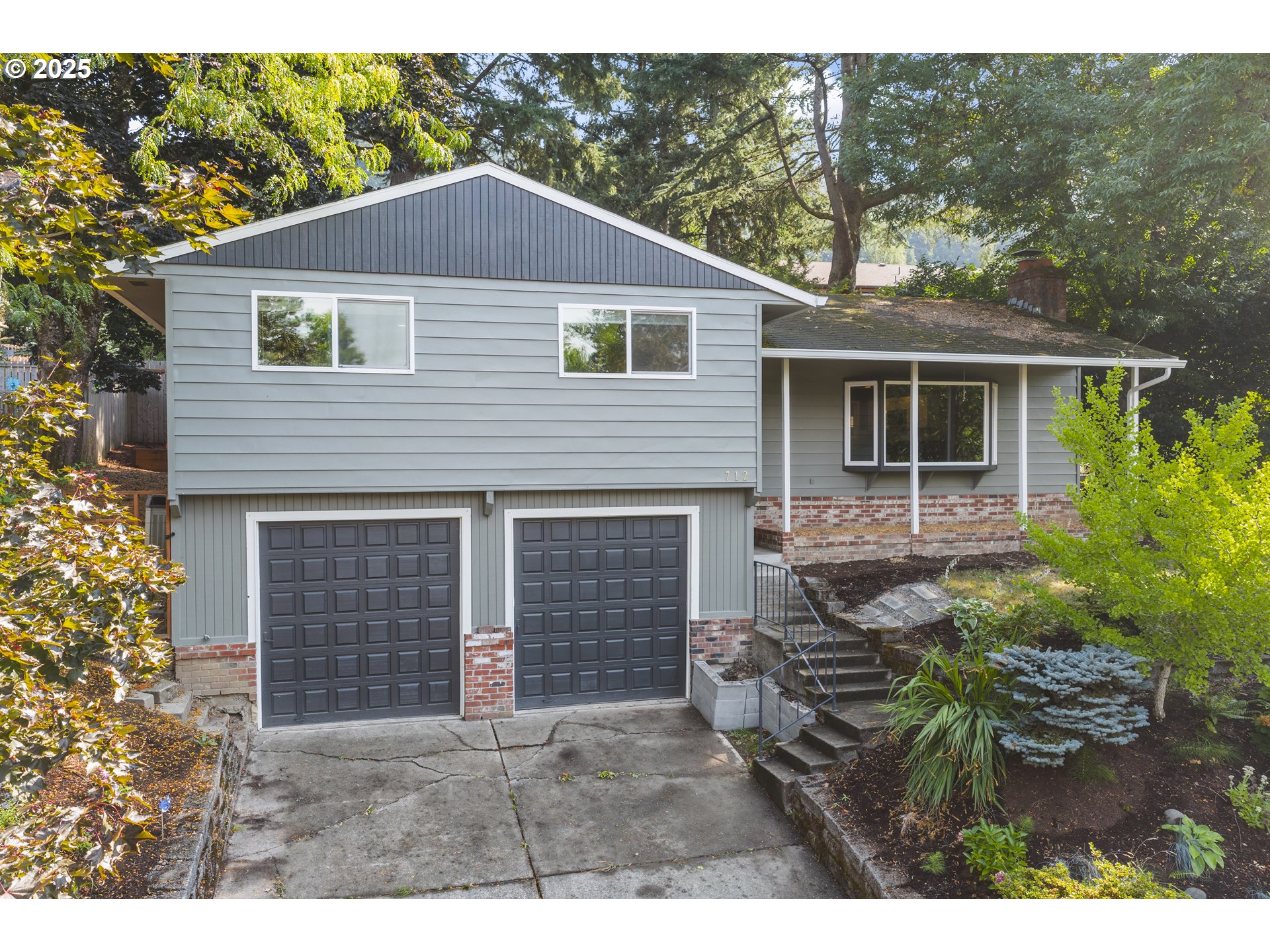 712 Southwest 4th Street Gresham, OR 97080 - Photo 2 of 47 a front view of a house with a yard