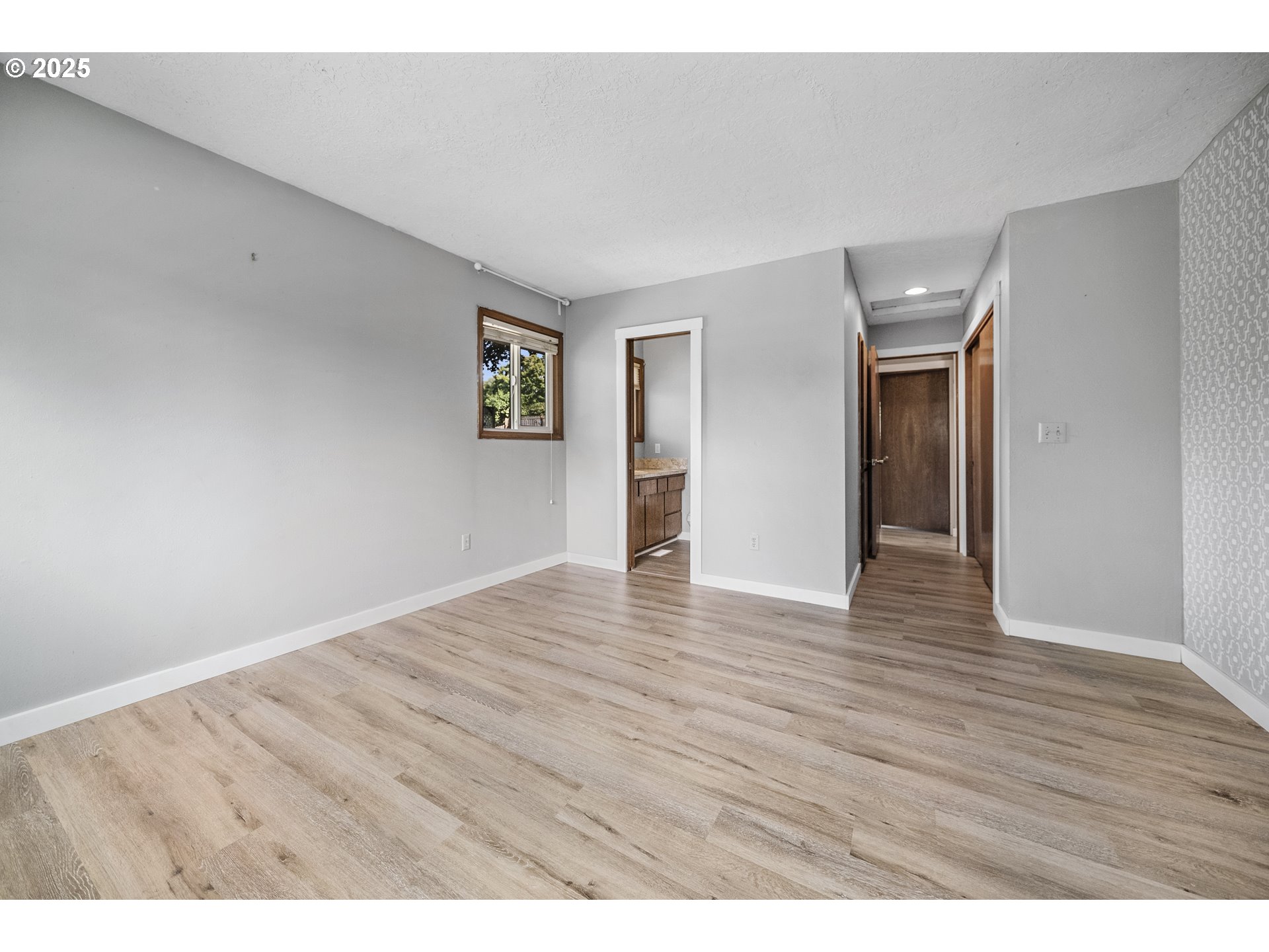 712 Southwest 4th Street Gresham, OR 97080 - Photo 24 of 47 a view of an empty room with wooden floor
