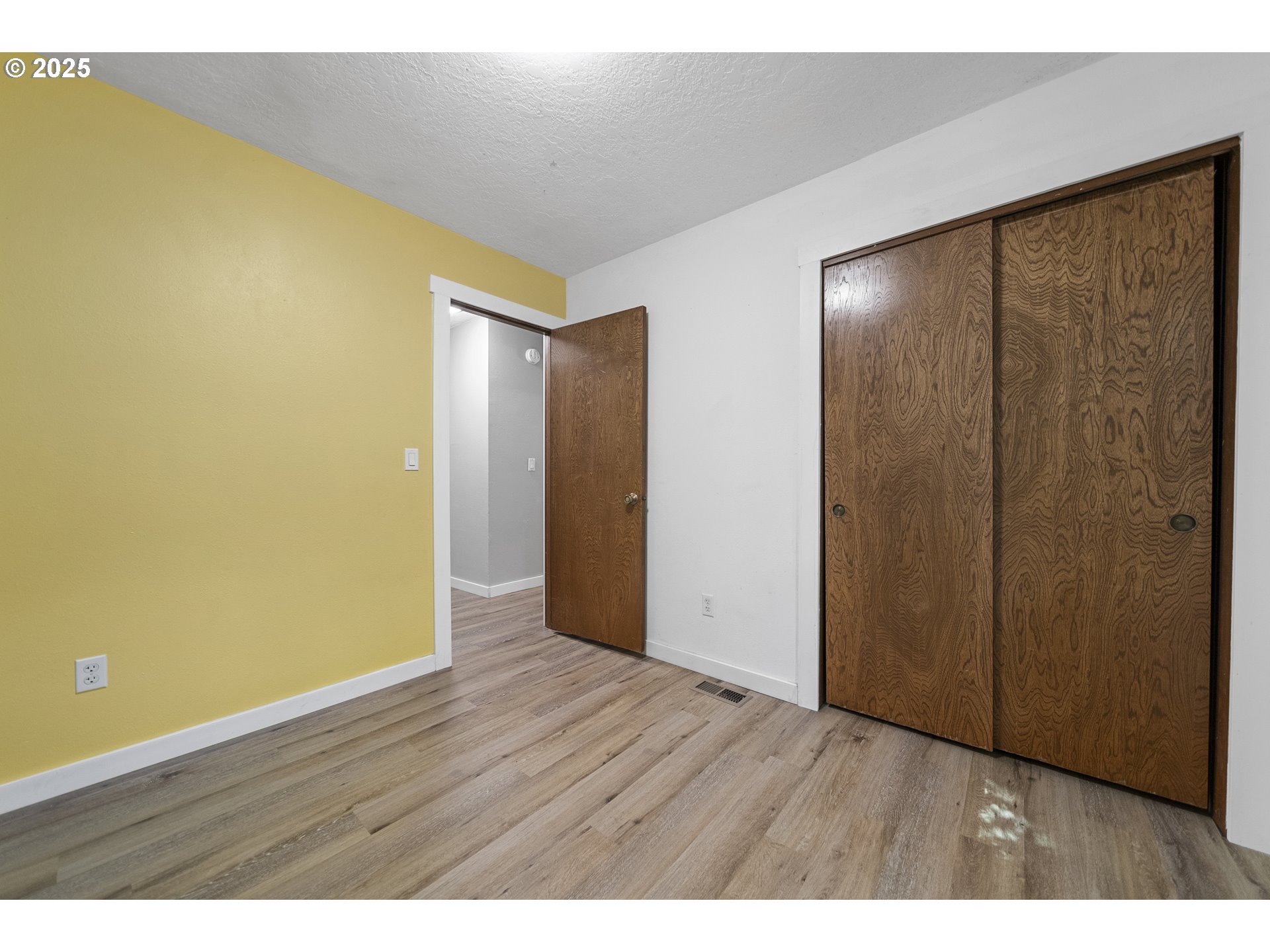 712 Southwest 4th Street Gresham, OR 97080 - Photo 26 of 47 a view of an empty room with wooden floor