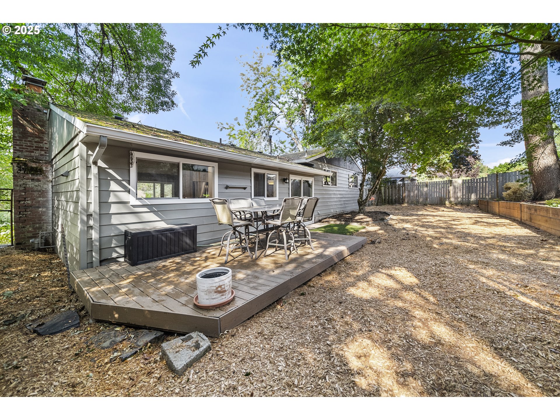 712 Southwest 4th Street Gresham, OR 97080 - Photo 38 of 47 a backyard of a house with table and chairs