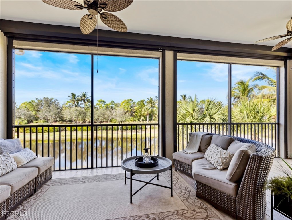 12894 New Market Street, Unit 202 Fort Myers, FL 33913 - Photo 2 of 44 a living room with furniture and a large window