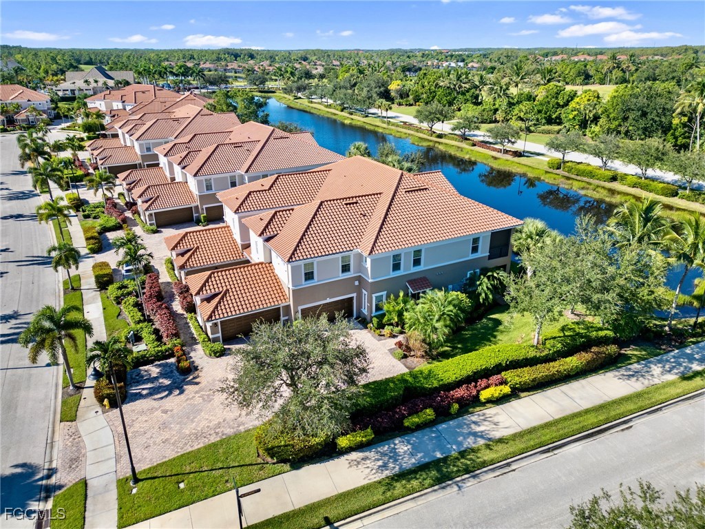 12894 New Market Street, Unit 202 Fort Myers, FL 33913 - Photo 42 of 44 an aerial view of house with yard