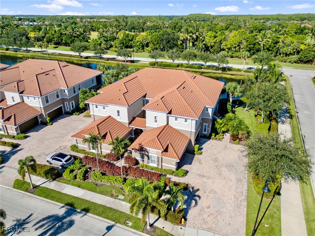 12894 New Market Street, Unit 202 Fort Myers, FL 33913 - Photo 43 of 44 an aerial view of a house with a garden