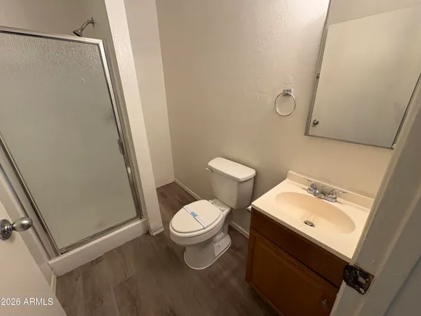 a white toilet sitting next to a bathroom sink