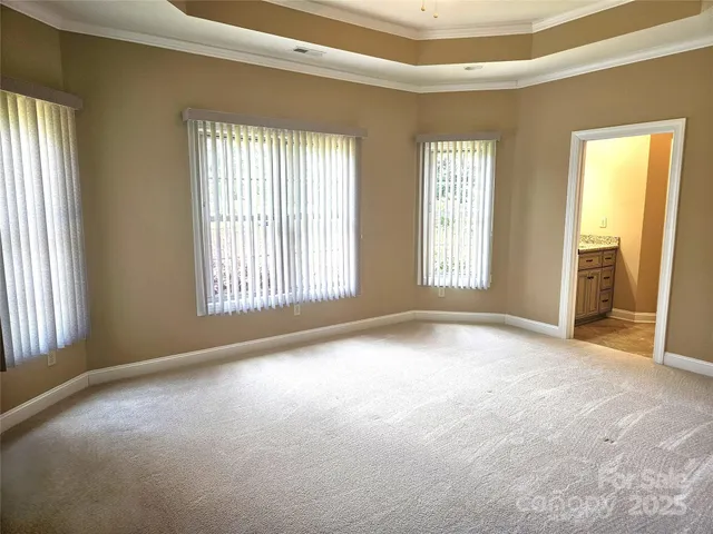 a view of an empty room with windows