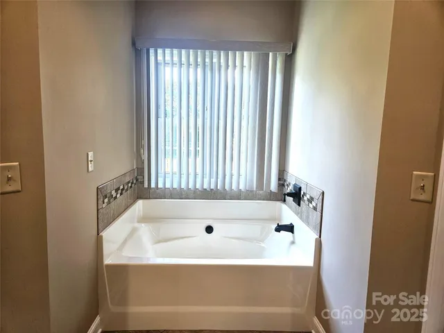 a bathroom with a bathtub