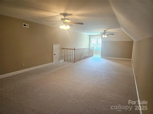 a view of a livingroom with a ceiling fan