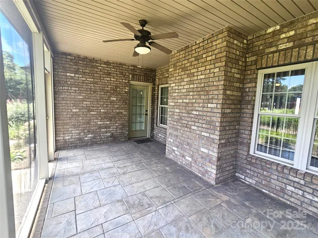 a view of empty room with windows