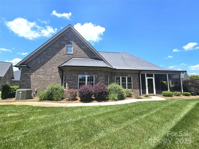 a front view of a house with a yard and porch