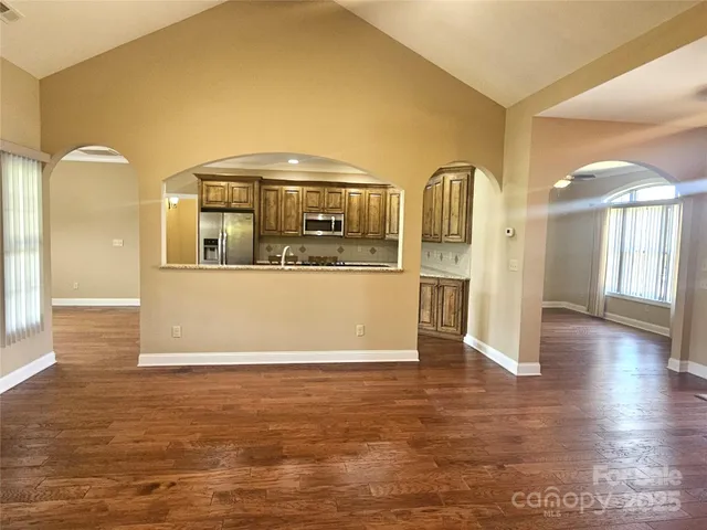 a view of a kitchen with a sink and cabinets