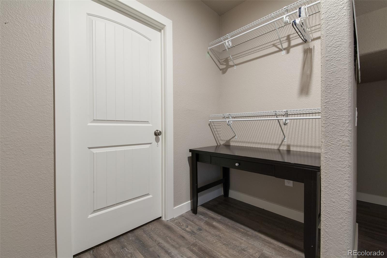 Undisclosed Address Castle Rock, CO 80104 - Photo 15 of 19 a room that has a bed and a table in it