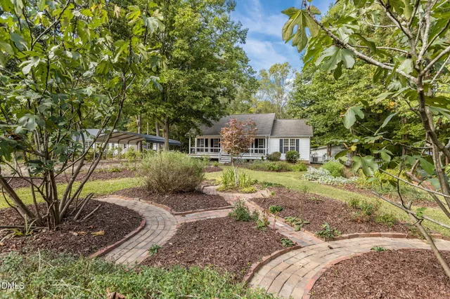 a view of a house with wooden fence