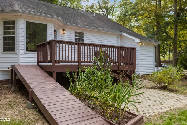 a view of outdoor space with deck and yard