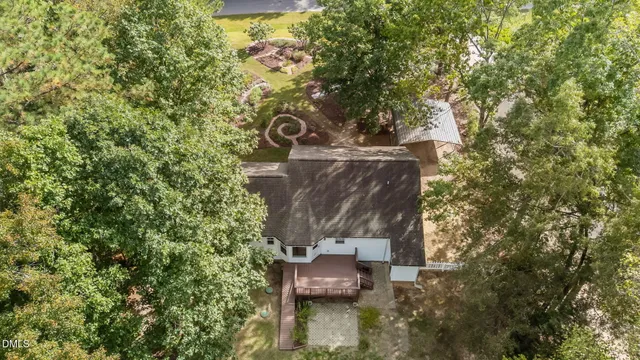 a view of a house with a tree
