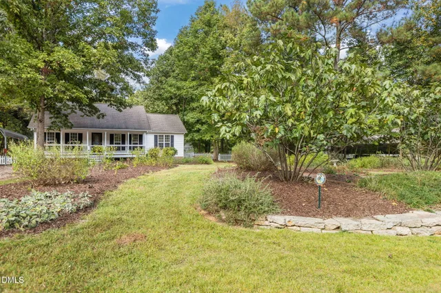 a house with swimming pool in front of it