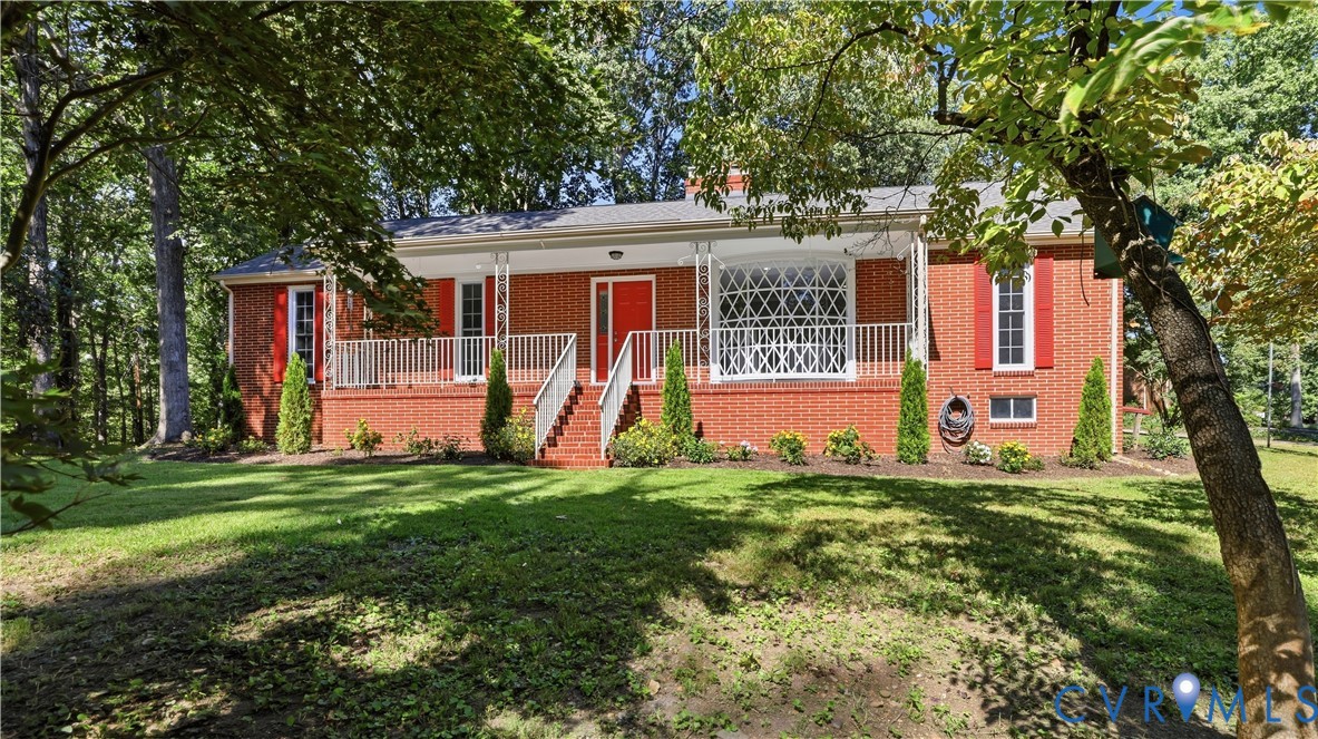 2301 Traymore Road North Chesterfield, VA 23235 - Photo 4 of 67 Brick exterior with red shutters, a covered front