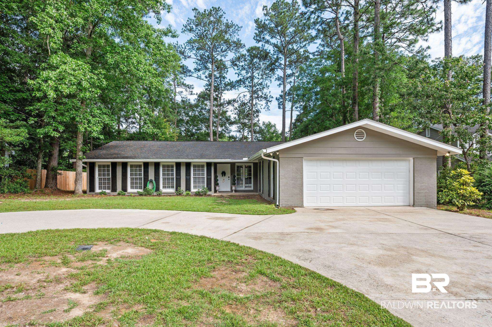 110 Ferncliff Circle Daphne, AL 36526 - Photo 1 of 40 Single story home with driveway, an attached garage, and brick siding