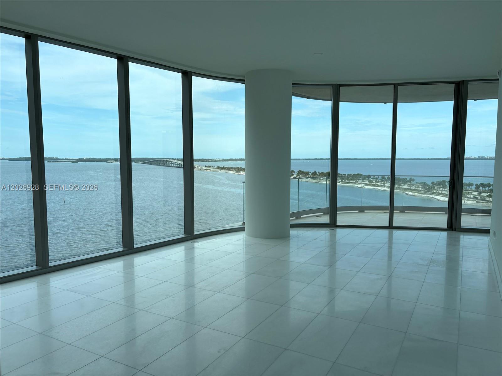 175 Southeast 25th Road, Unit 901 Miami, FL 33129 - Photo 4 of 18 an empty room with sliding glass door and mountain view
