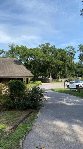 a view of a street with a building in the background