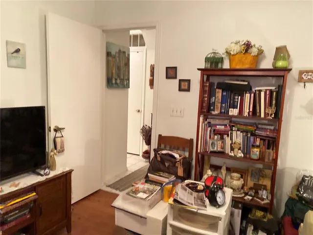 a bathroom with a sink a toilet a mirror and shower curtain