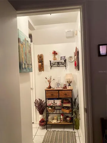 a living room with furniture and a piano