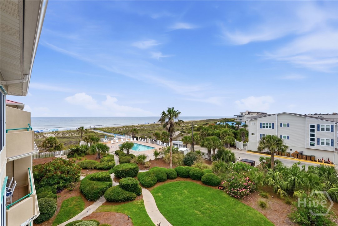 214 Butler Avenue, Unit 306 Tybee Island, GA 31328 - Photo 7 of 49 View from balcony of lush landscaping, community pool and the Atlantic Ocean