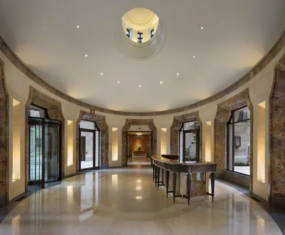 a view of a lobby with furniture and floor to ceiling window